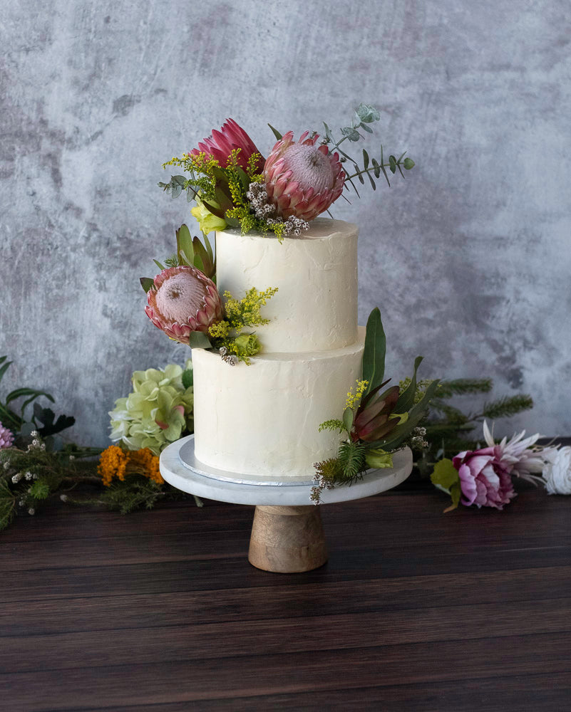 Two-tiered white cake with floral decorations for a 40th birthday held at the left bank bar, fremantle perth