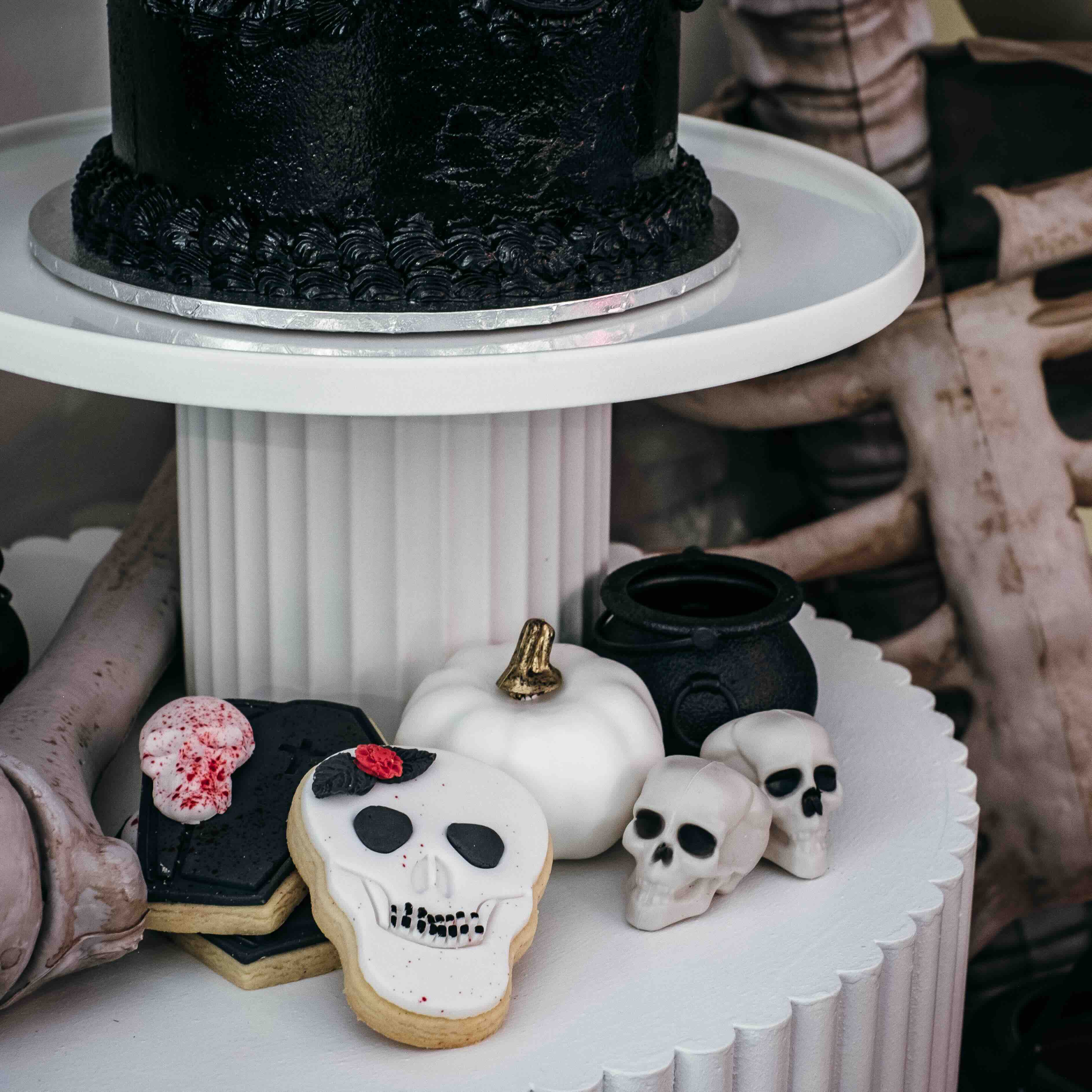 Decorated shaped cookies shaped as halloween skulls