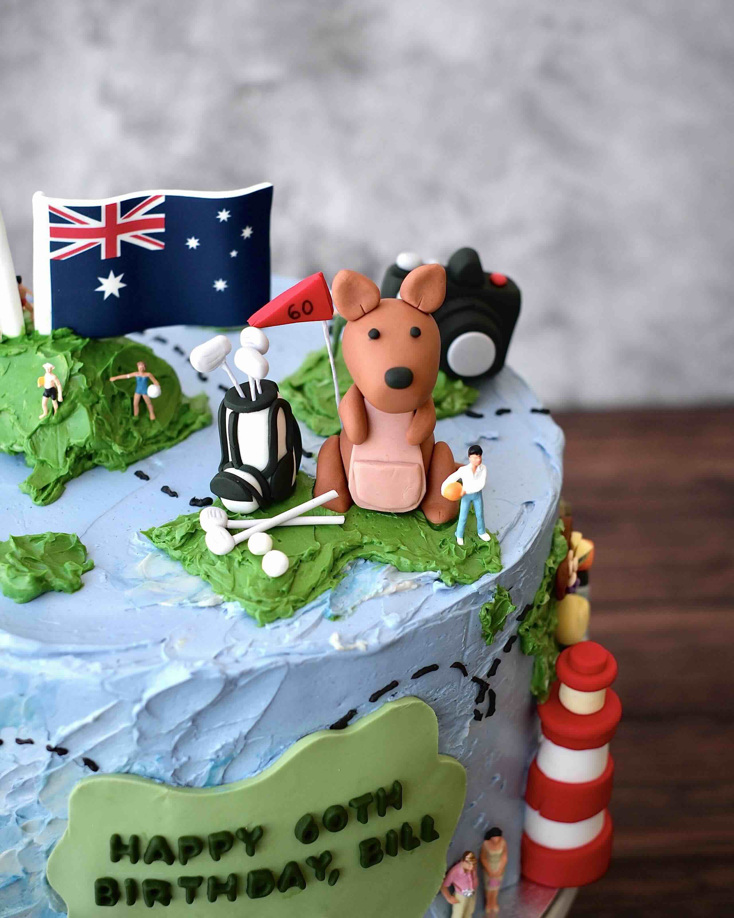 a fondant shaped kangaroo with a set of edible golf clubs on Australia 